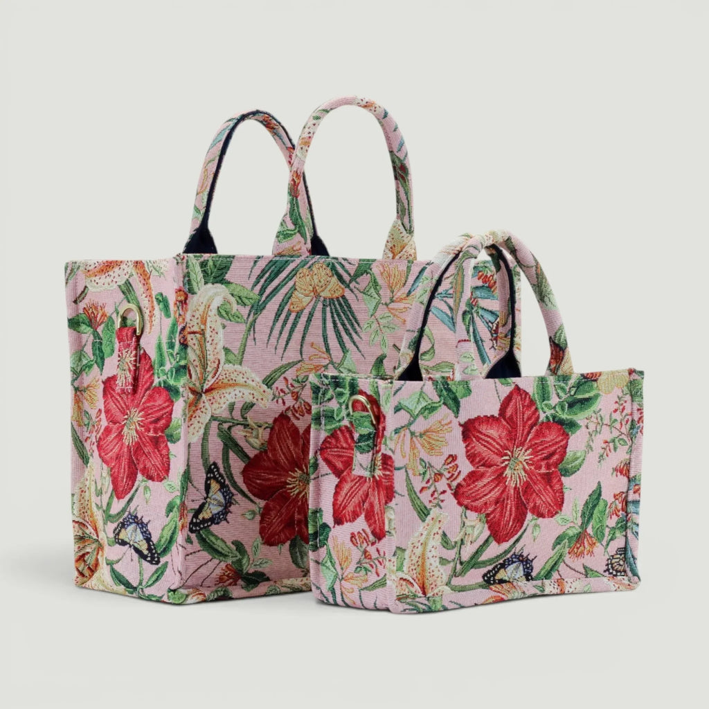 GJEN DESIGN floral tapestry tote bags in pink with red flowers and butterfly accents, featuring sturdy top handles.
