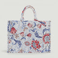 GJEN DESIGN floral tapestry tote bag with red and blue botanical print and sturdy top handles.