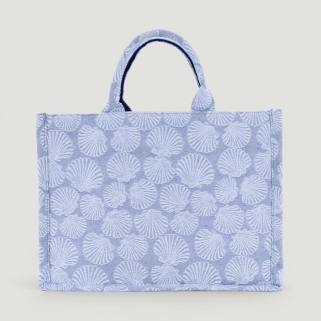 GJEN DESIGN structured tote bag in blue and white with an all-over seashell pattern and sturdy top handles.
