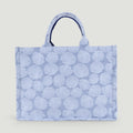 GJEN DESIGN structured tote bag in blue and white with an all-over seashell pattern and sturdy top handles.