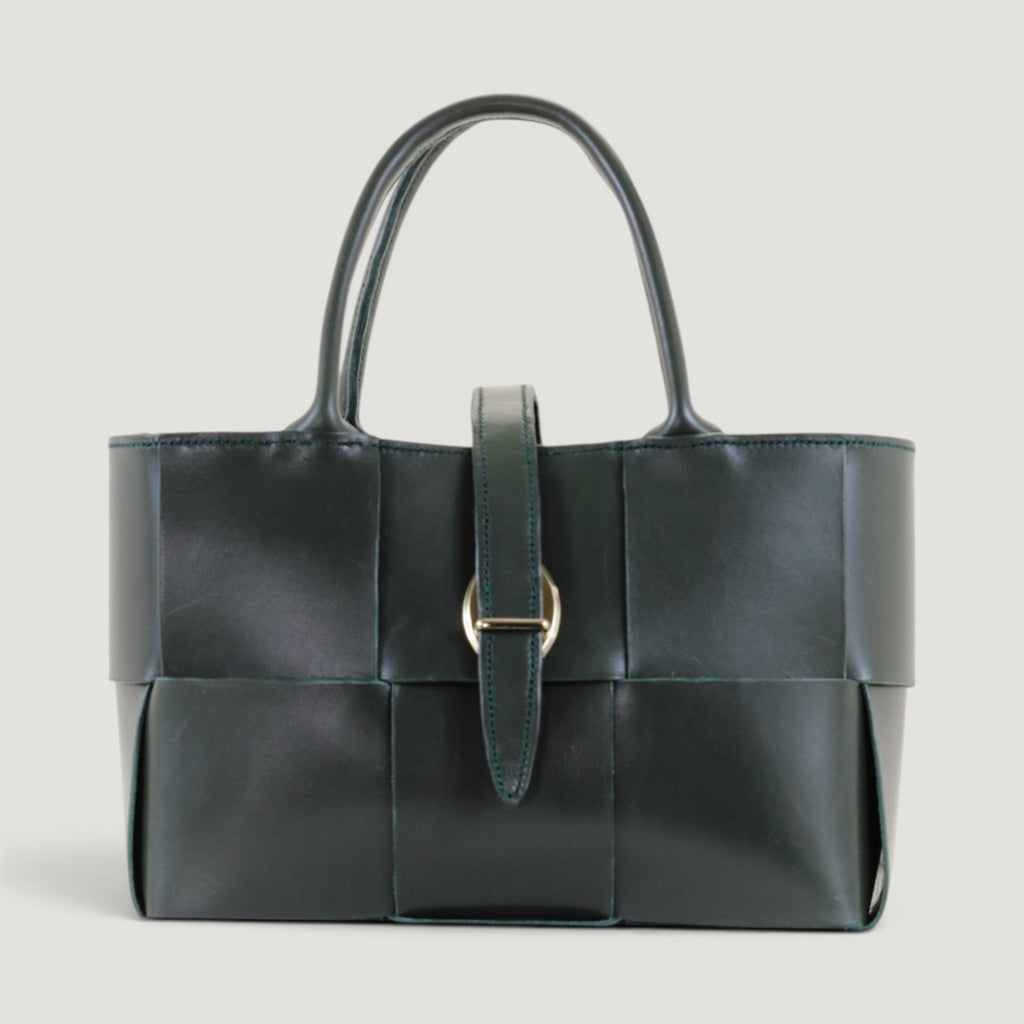 GJEN DESIGN forest green woven leather structured handbag with gold-tone buckle closure and top handles.